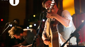 Potograph of Mumford and Sons perfromaing in the Live Lounge at Radio 1
